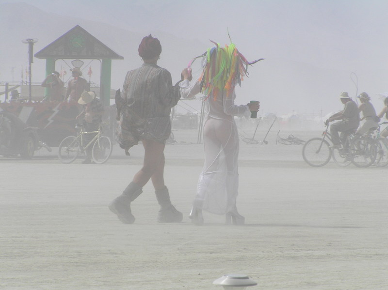 Dust storm hides hot chick more than her clothes.